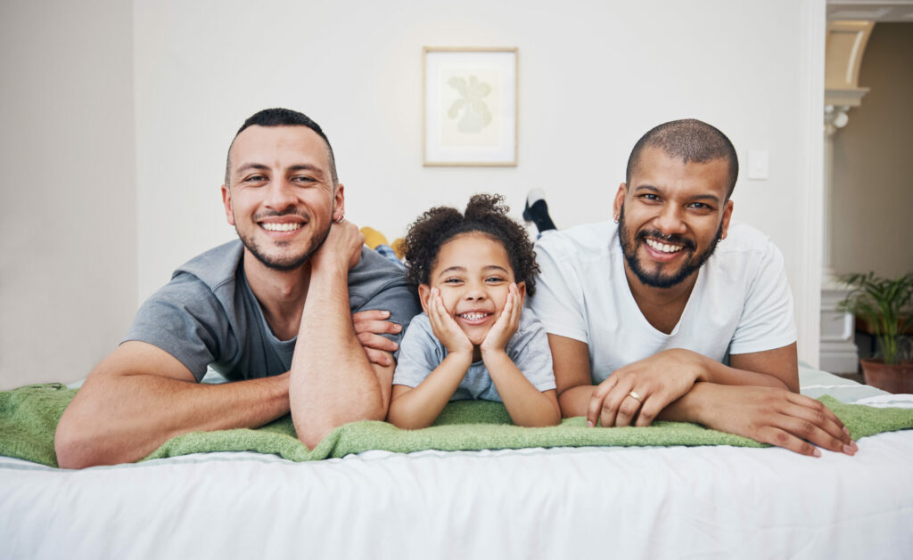 Image of gay parents in NYC with parental sensitivity